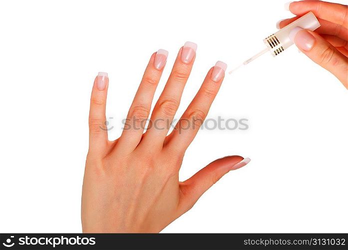 Woman applying white nail polish