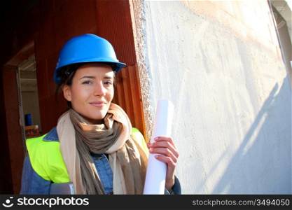 Woman architect standing on construction site