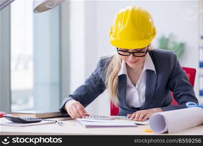Woman architect working on the project . Woman architect working on project