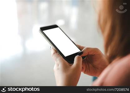 Woman are using the phone in a blank screen.