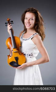 Woman artist with violin in music concept