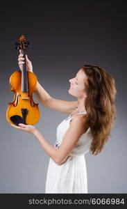 Woman artist with violin in music concept