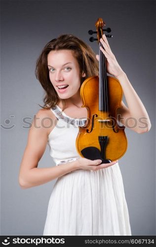 Woman artist with violin in music concept