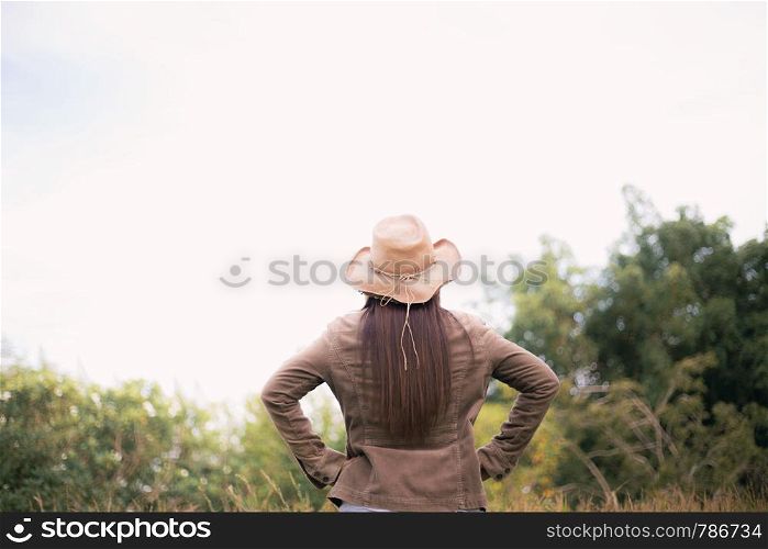 Woman asian of traveling in forest with the sky.