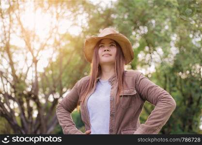 Woman asian of traveling in forest with the sunlight.