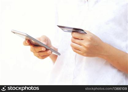 woman asian using smartphone and credit card shopping online , selective focus on hand