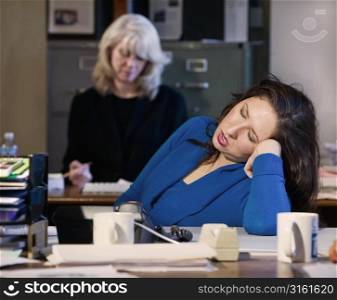 Woman asleep at her desk