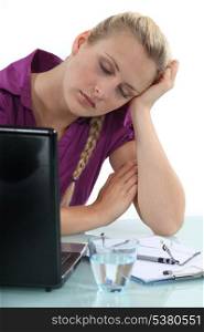 Woman asleep at her desk