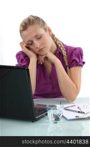 Woman asleep at her laptop