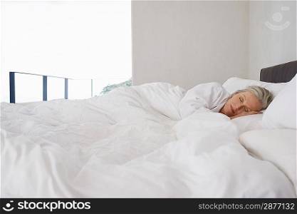 Woman Asleep in Bed