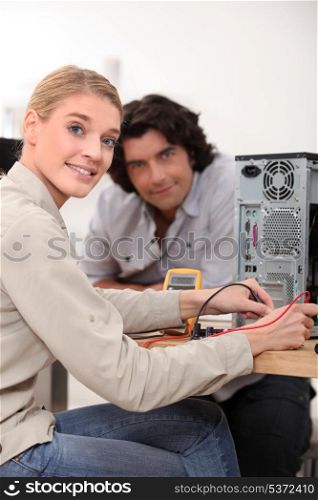 Woman assessing problem with computer