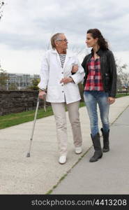 Woman assisting a senior lady