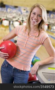 Woman at a bowling lane