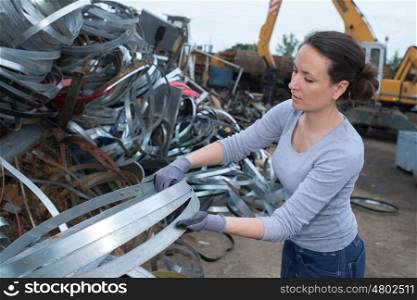 woman at a junkyard