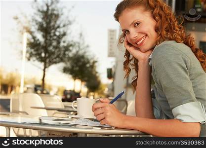 Woman at a Sidewalk Cafe