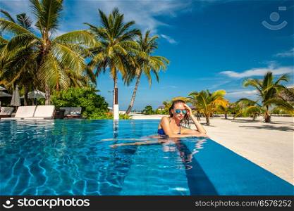 Woman at beach swimming pool in Maldives