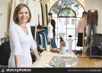 Woman at clothing store smiling