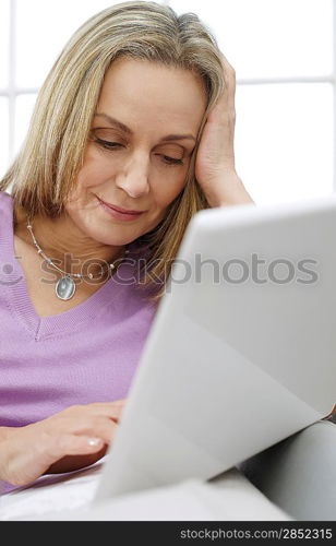 Woman at Home Using Laptop
