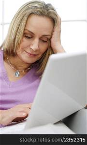 Woman at Home Using Laptop
