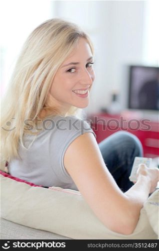 Woman at home watching television