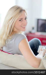 Woman at home watching television