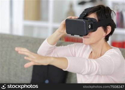 woman at home with head-mounted display on