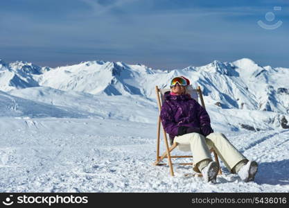 Woman at mountains in Santa hat celebrating christmas, Meribel, Alps, France