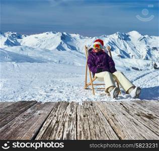 Woman at mountains in Santa hat celebrating christmas, Meribel, Alps, France