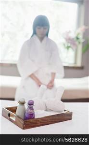 Woman at Spa with Herbs and Oils