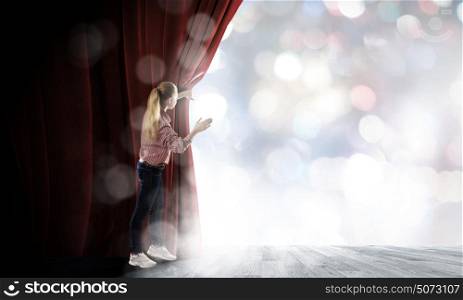 Woman at stage. Young woman in casual opening red curtain