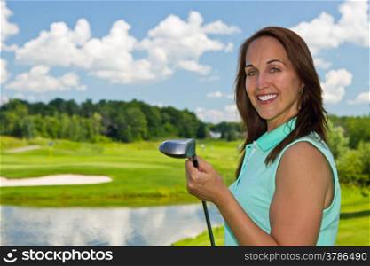 Woman at the golf course on a beautiful summer day