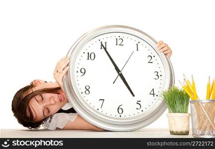 Woman at work holding large clock