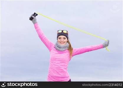 Woman athlete fit girl training outdoor with jumping skipping rope wearing warm sporty clothes in cold day. Sports activity in winter or autumn time, healthy lifestyle concept. Woman training outdoor with jump rope on cold day