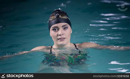 Woman athlete in swimming pool water. Water sport comptetition exercise. Human swimmer training.. Woman athlete in swimming pool water. Sport.