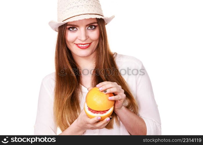 Woman attractive long hair girl colorful eyes makeup holding two halfs of grapefruit citrus fruit in hands. Healthy diet food. Summer vacation holidays concept. Woman holds two halfs of grapefruit citrus fruit in hands