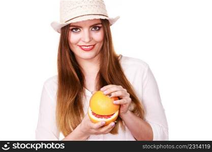 Woman attractive long hair girl colorful eyes makeup holding two halfs of grapefruit citrus fruit in hands. Healthy diet food. Summer vacation holidays concept. Woman holds two halfs of grapefruit citrus fruit in hands