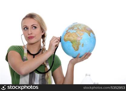Woman auscultating globe