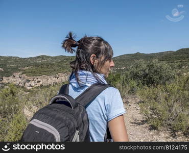 woman backpacker enjoying the view of nature