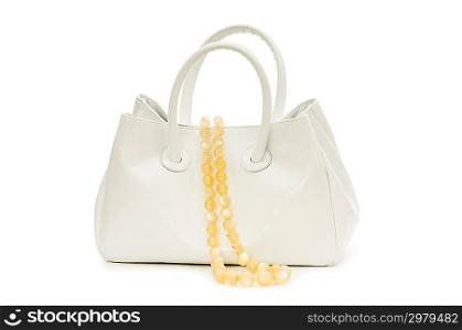 Woman bag and necklace isolated on white