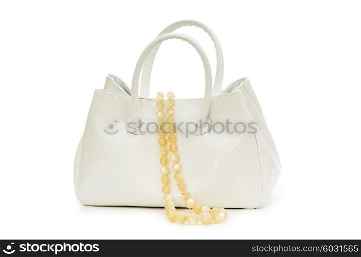 Woman bag and necklace isolated on white