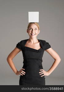 Woman Balancing Blank Sign on Head
