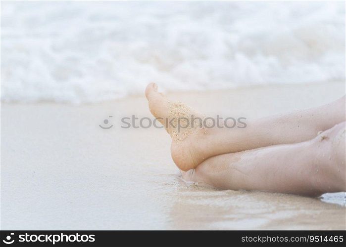 Woman bare foot walking on the summer beach. close up leg of young woman walking along wave of sea water and sand on the beach. Enjoyment barefoot walk outdoor with freedom. Relaxation Travel Concept.