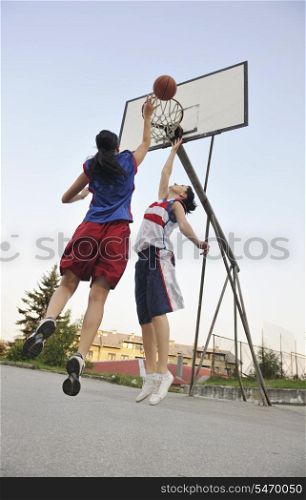woman basketball player have treining and exercise at basketball court at city on street
