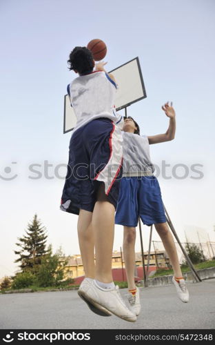 woman basketball player have treining and exercise at basketball court at city on street