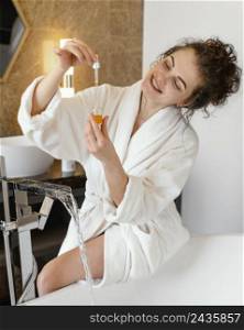 woman bath robe preparing bathtub 4
