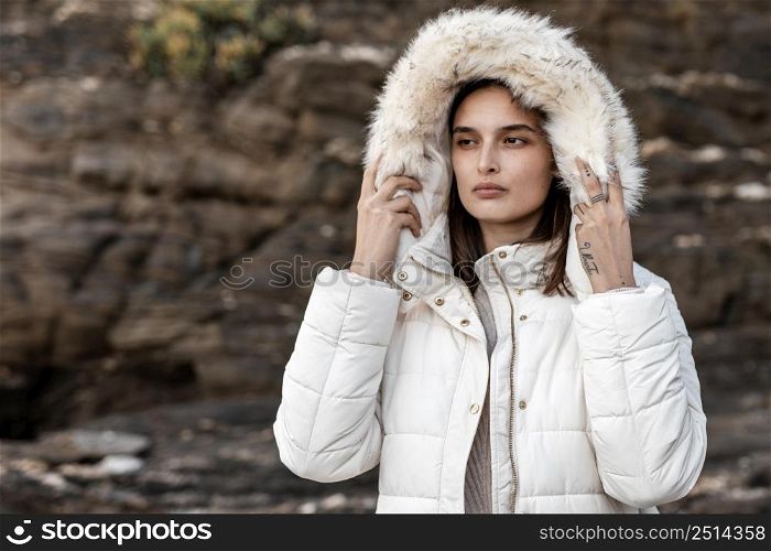 woman beach with winter jacket
