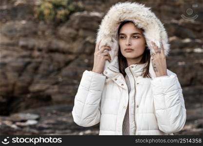 woman beach with winter jacket