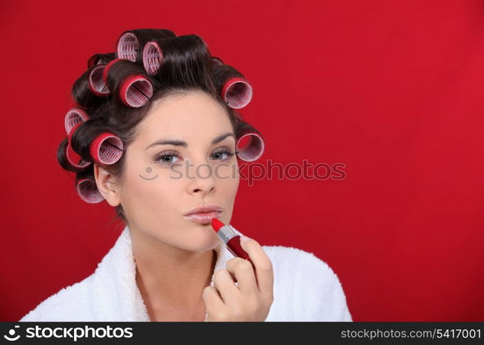 Woman beautifying herself