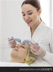 woman beauty clinic face treatment 2