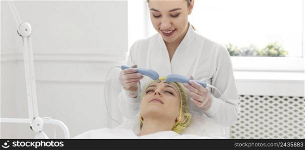woman beauty clinic face treatment